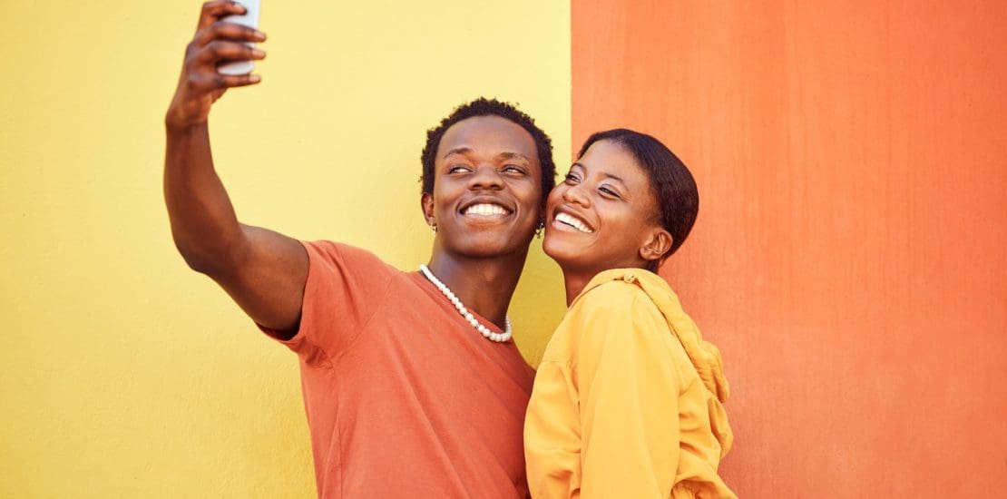 Gen z, young black couple happy in selfie with smartphone and influencer with post for social media