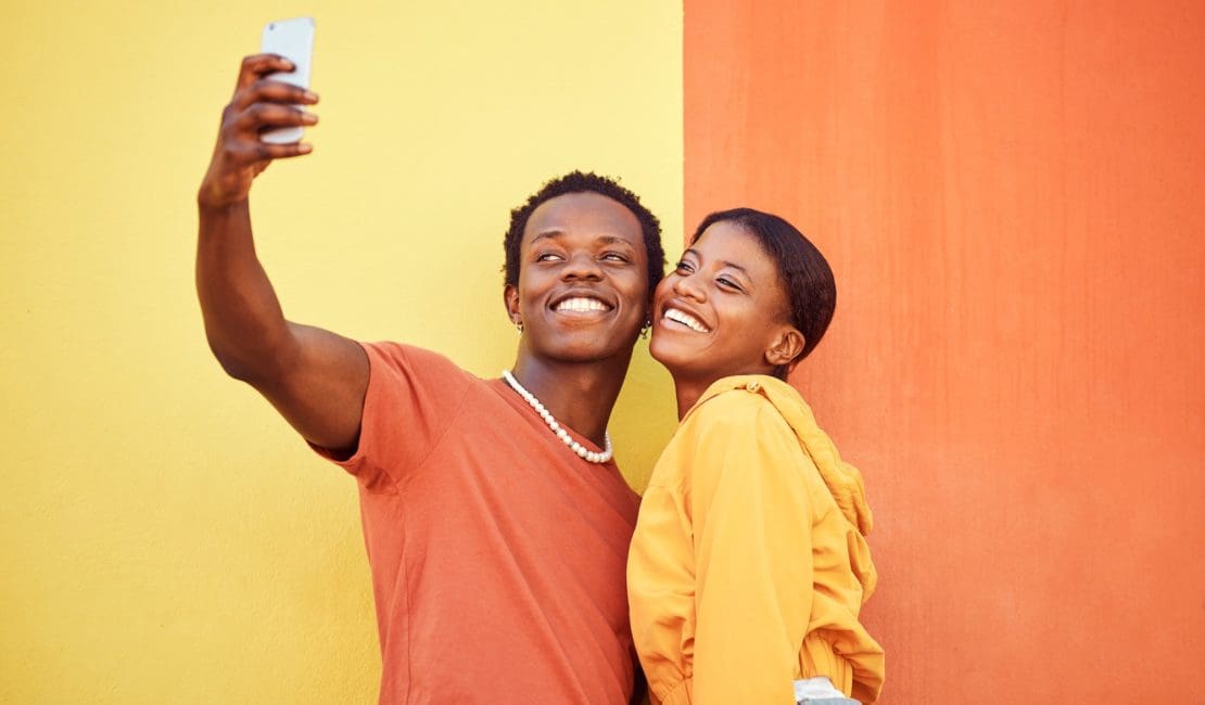 Gen z, young black couple happy in selfie with smartphone and influencer with post for social media