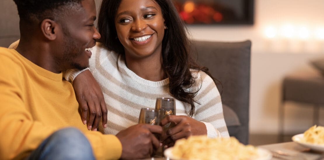 Happy African American Couple Clinking Glasses Celebrating Valentine At Home