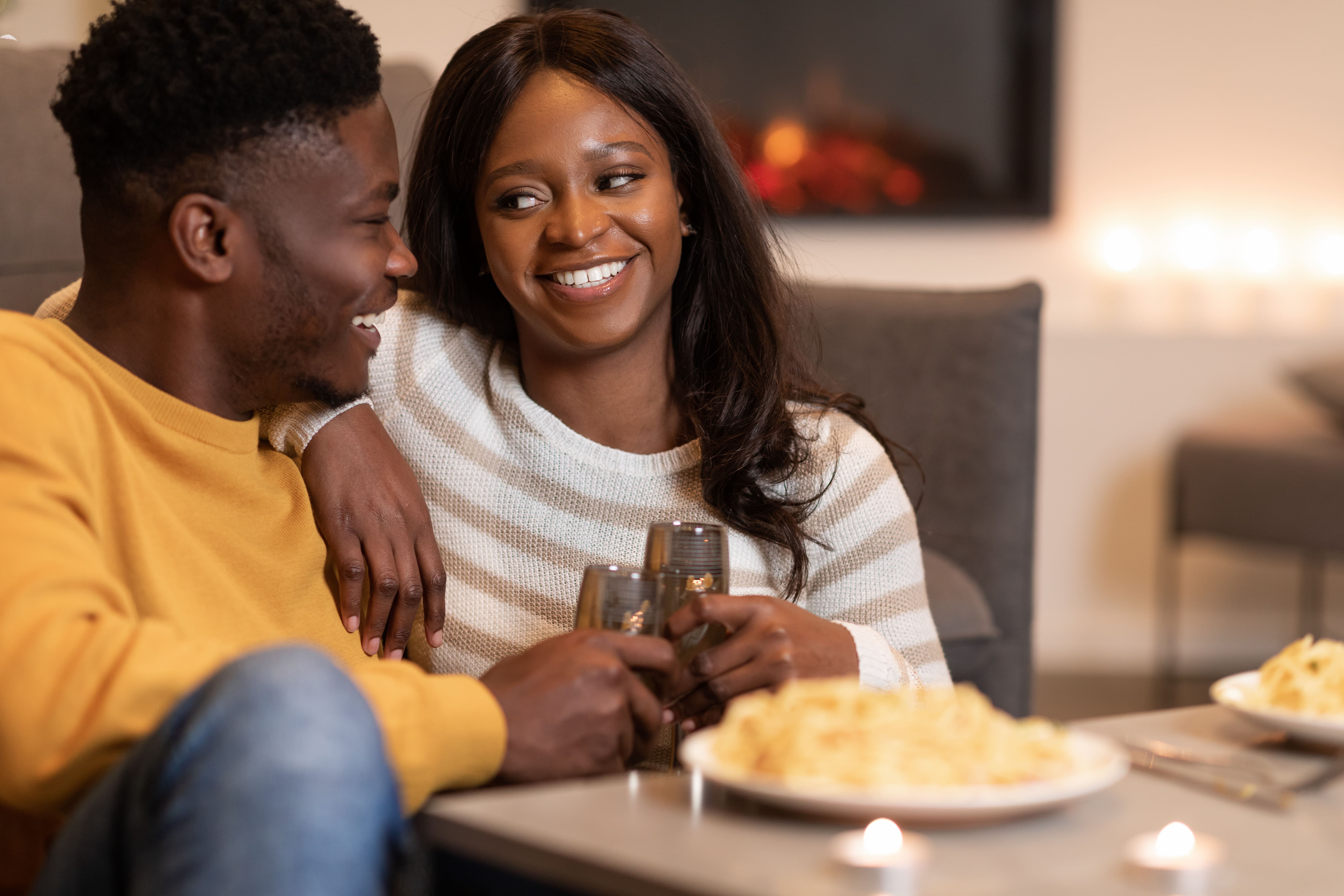 Happy African American Couple Clinking Glasses Celebrating Valentine At Home