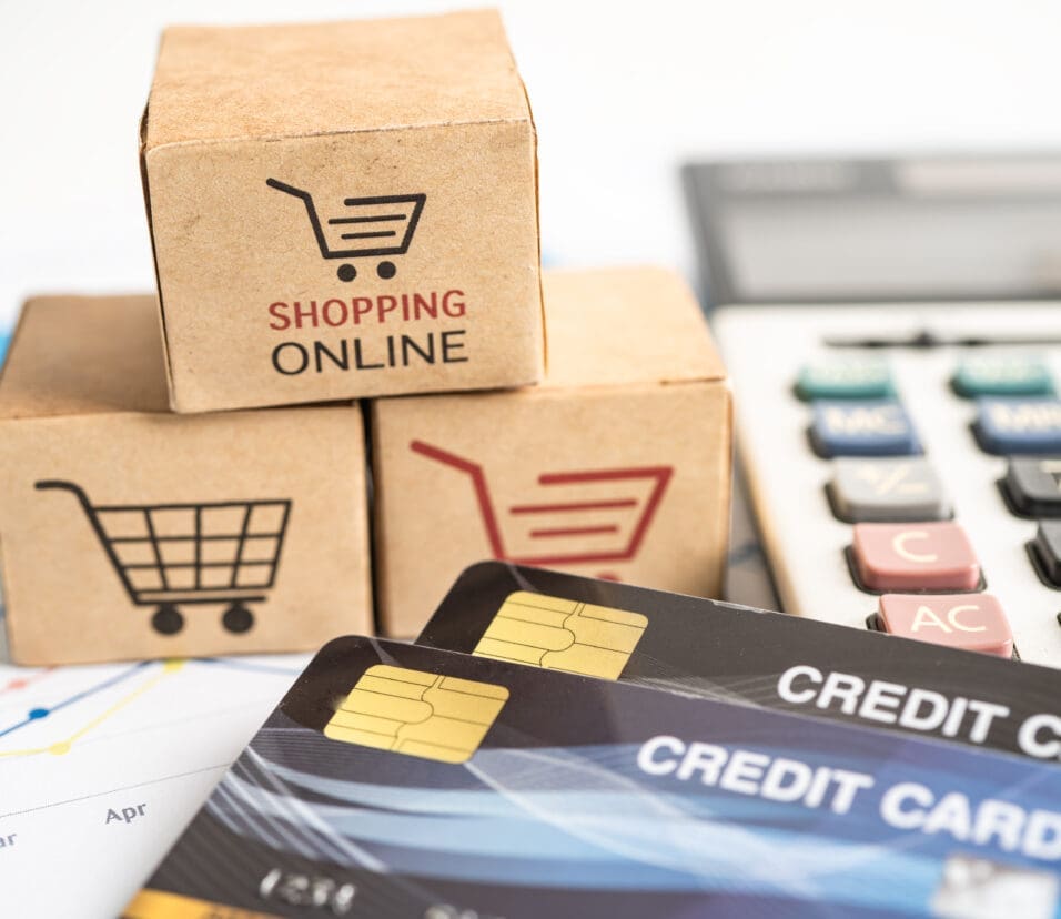 Shopping online box with credit card and calculator on graph. Finance commerce import export